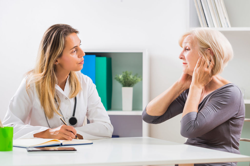 doctor and patient at a hearing evaluation exam